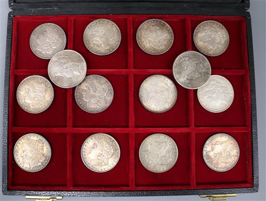 Fourteen assorted American silver dollars.